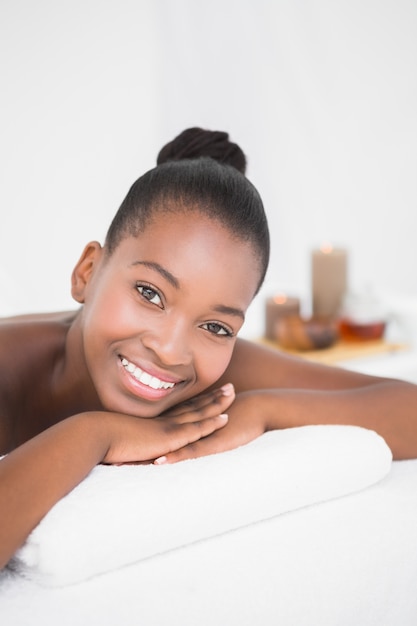 Peaceful pretty woman lying on massage table 