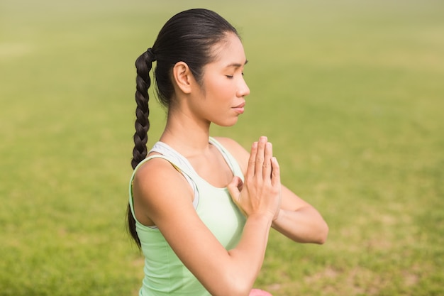 Peaceful sporty woman doing yoga