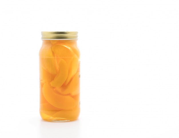 peach in bottle on white