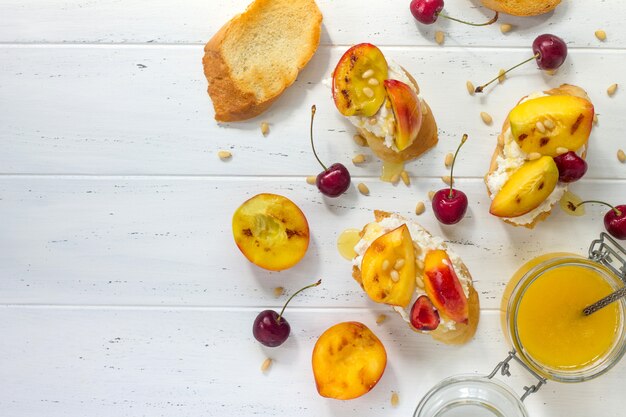 Peach and cherry sandwiches with nuts and honey