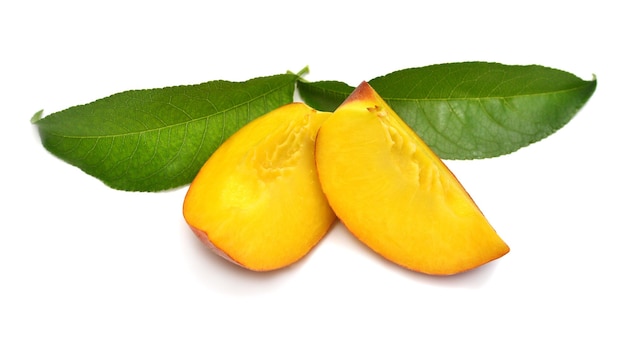 Peach fruit slice with leaf isolated on white background Perfectly retouched full depth of field on the photo Flat lay top view