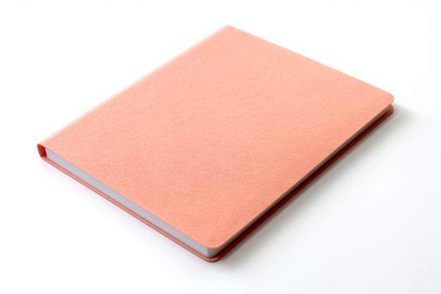 Foto peach fuzz color notebook op witte achtergrond