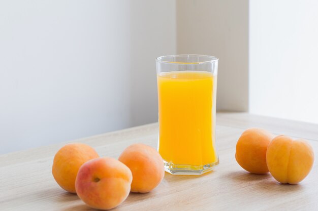 Peach juice on wooden table