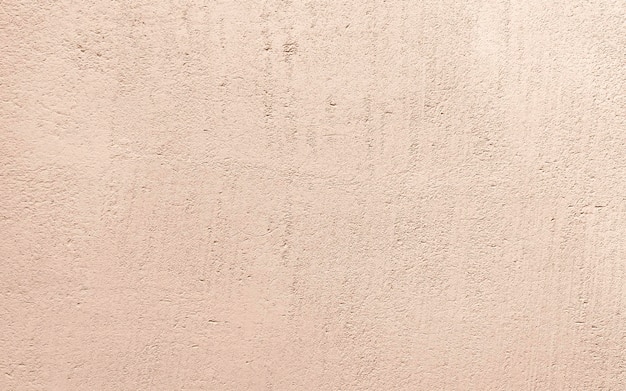 peach plaster textured wall background