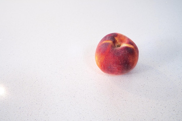 Peach on white background world food day