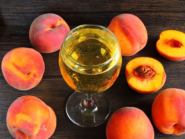 Peach wine. Fluffy peaches. Close up.