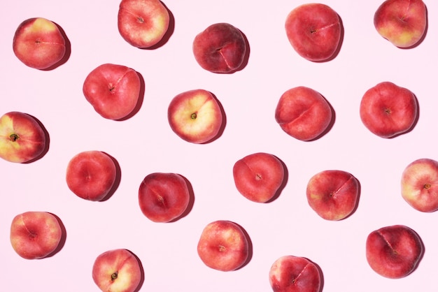 Peaches pattern on pastel pink background