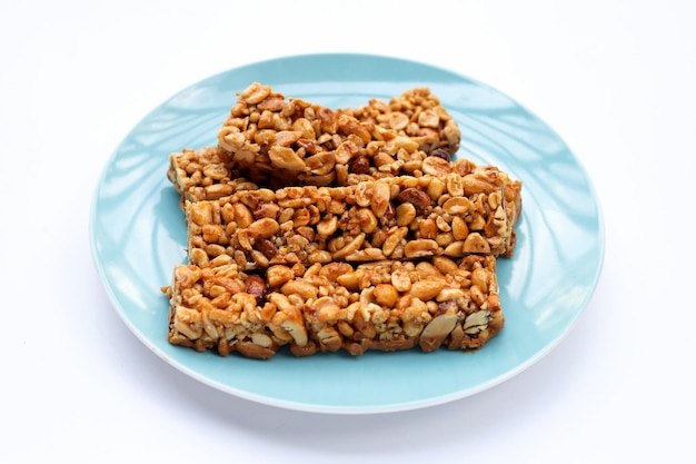 Peanut bar with almonds on white