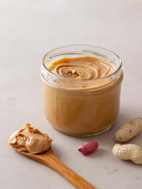 Peanut butter in a jar. Breakfast. Vegetarian food.