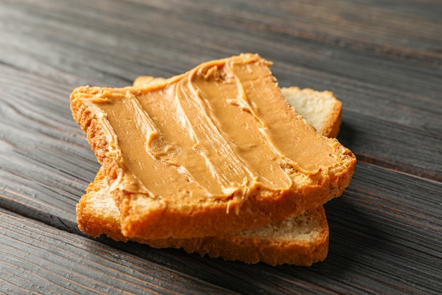 Peanut butter sandwich on wooden table