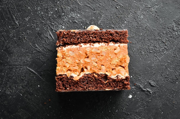 Peanut chocolate cake Dessert On a black background Top view