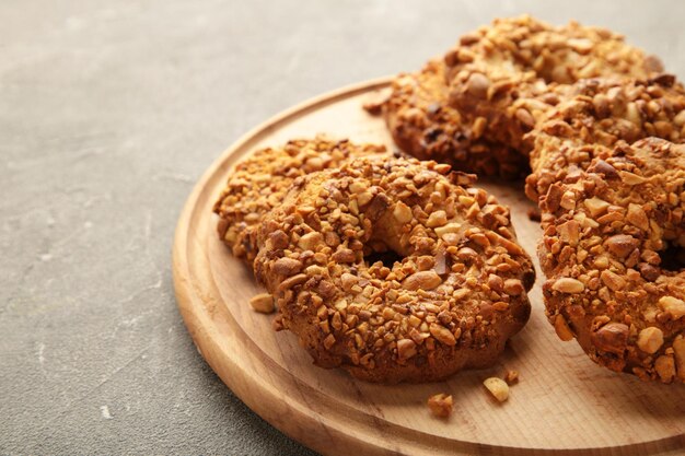 Peanut cookies on cutting board on grey background. Bakery products.