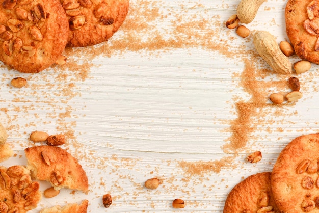 Peanut cookies on wooden table with sugar