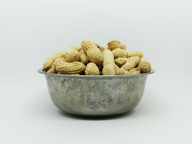 Peanut ground nuts isolated in white background peanut in metal bowl