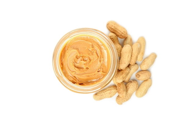 Peanut and jar with peanut butter isolated