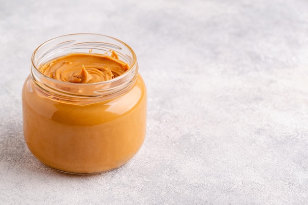 Peanut paste in an open jar