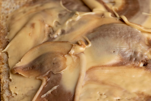 Peanut paste with chocolate paste on white bread making sandwiches from mixed chocolate peanut paste and bread