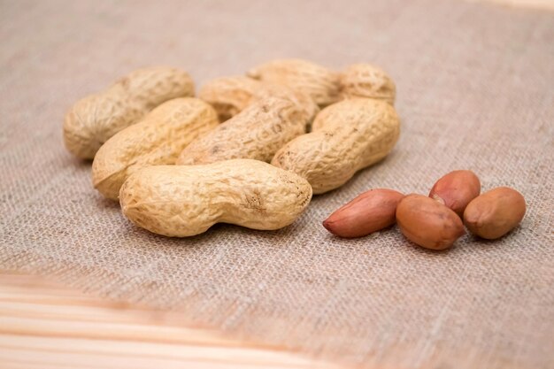 Peanut in a peel on a linen background