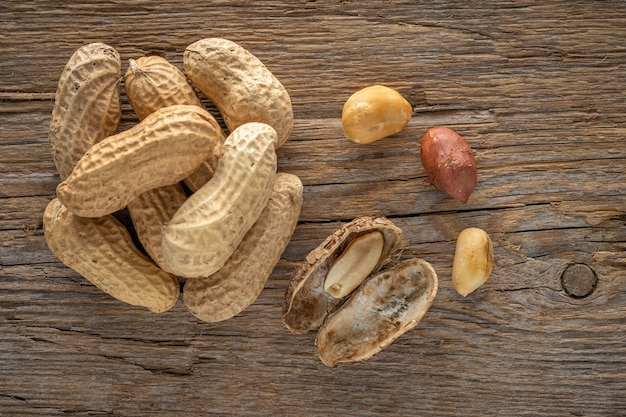 Peanut in a shell on wooden table