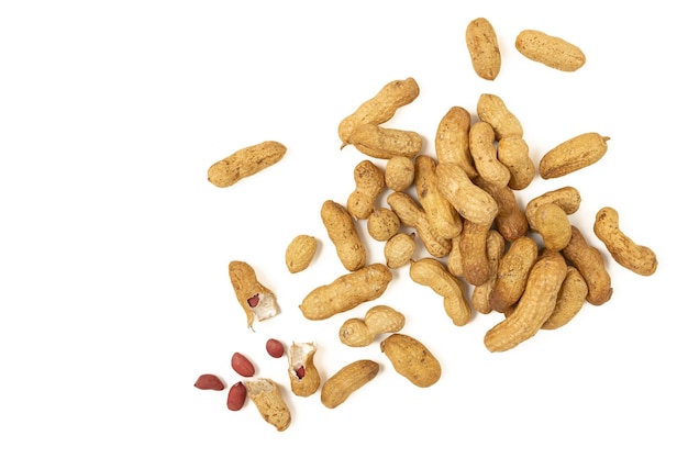 Peanuts are scattered on a white background.