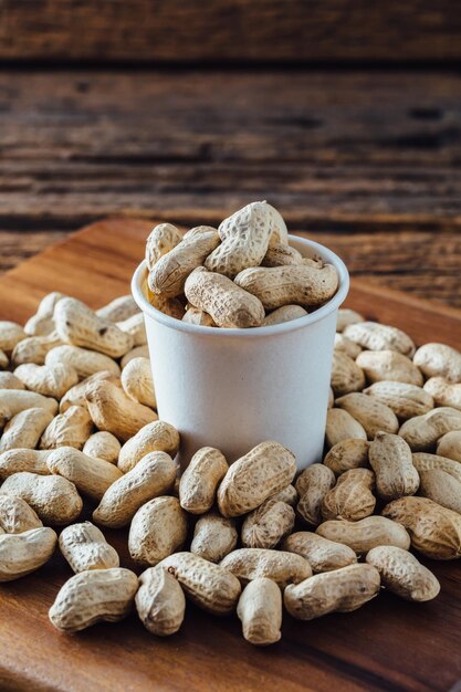 Peanuts from the farm on wooden background