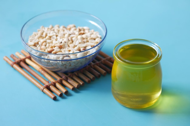 Peanuts and oils in a container