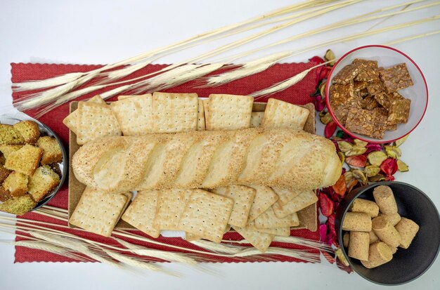 Peanuts in the shape of sweets pacoca cornmeal cake and peanut butter on bread