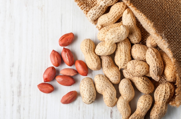 Peanuts in shells on wood