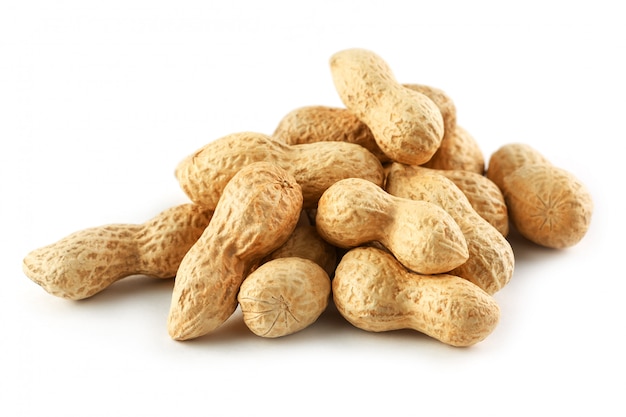 Peanuts. Two peeled nuts isolated on white background. Peanut macro.