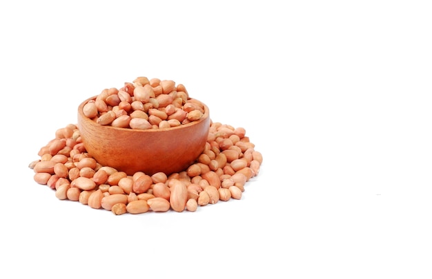 Peanuts with wooden bowl isolated on white background