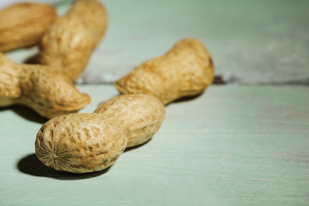 Peanuts on wooden background