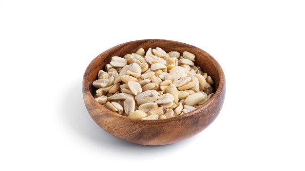 Peanuts in wooden bowl isolated on a white background. High quality photo