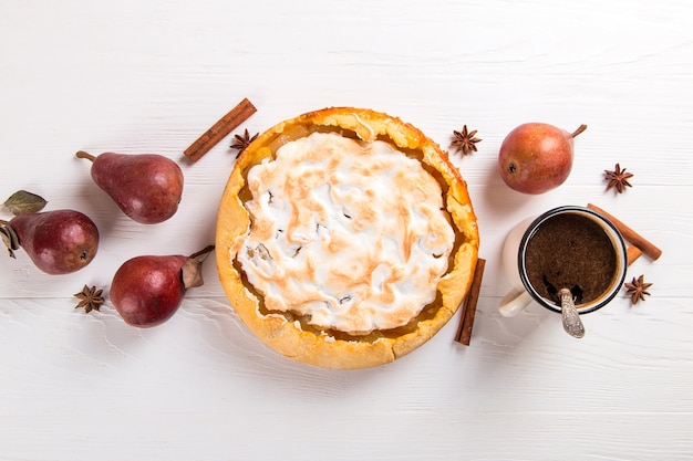 Pear delicious pie and coffee, homemade pastry with cinnamon, sweet dessert for breakfast. Copy space.