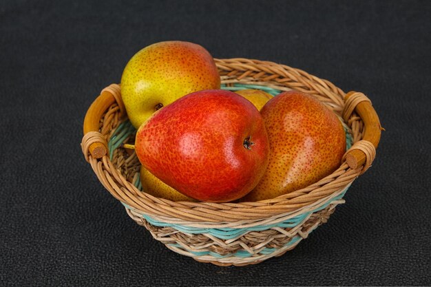 Pear heap in the wooden basket