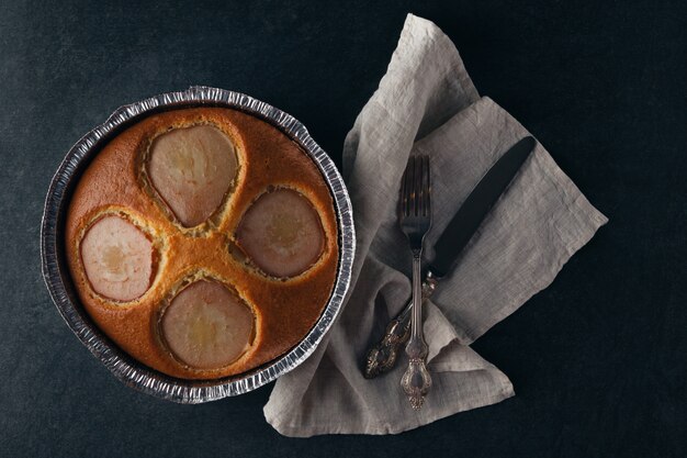 pear pie in holder on table