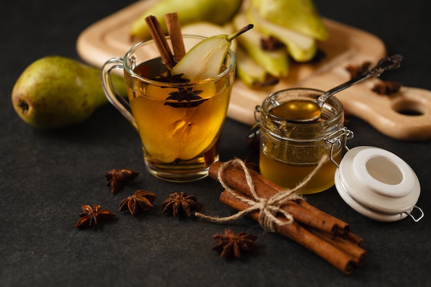 pear punch with sliced fruits and cinnamon