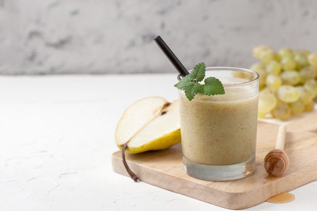 Pear smoothie on cutting board