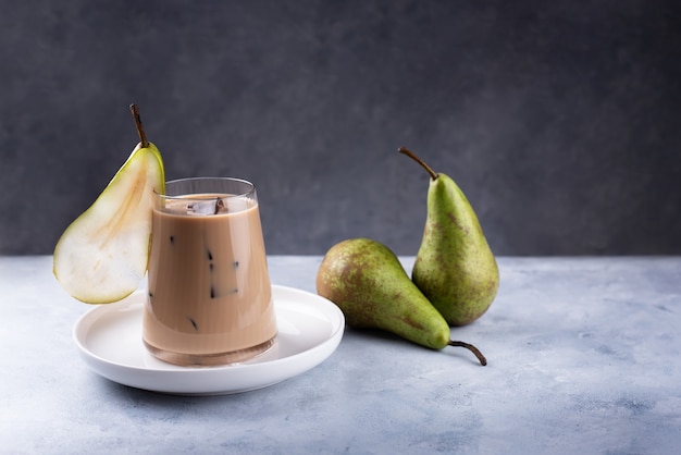 Pear spice latte with green pears close up.