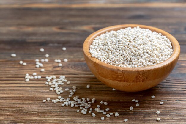 Pearl barley in a wooden bowl