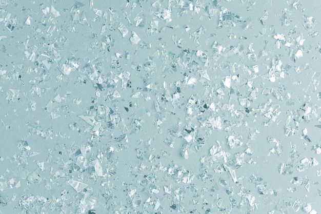 Pearl confetti sparkles on blue background