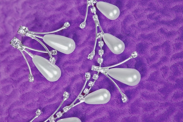 pearl jewelry wedding decoration on a purple background close pu