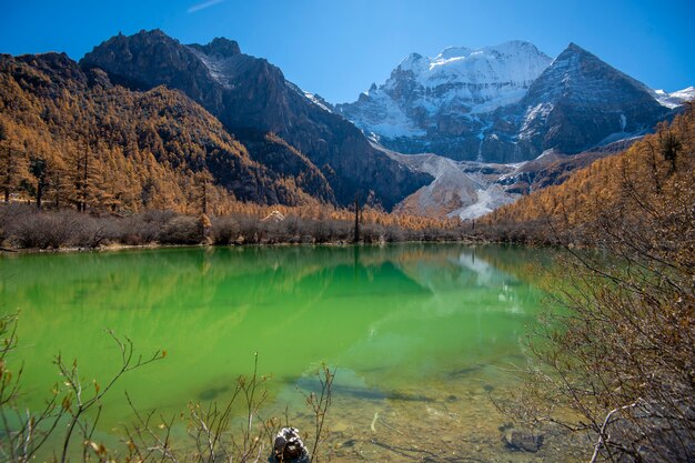 Pearl lake with snow mountain in yading nature reserve, Sichuan, China.