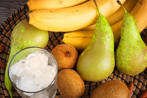 Pears and bananas on a wicker napkin round