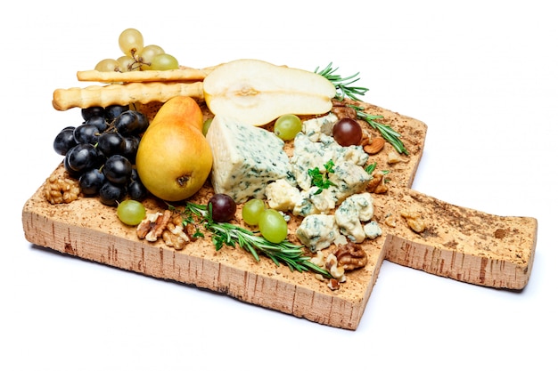 Pears and cheese on wooden cutting board