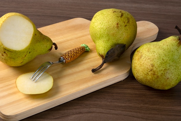 Pears over wood background