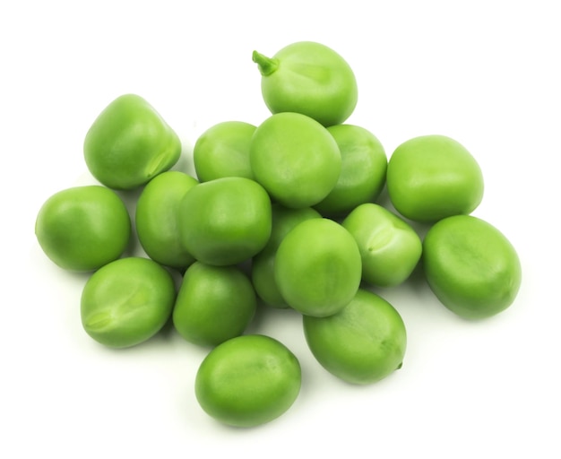 Peas isolated. Kernels of green peas on a white background, top view.