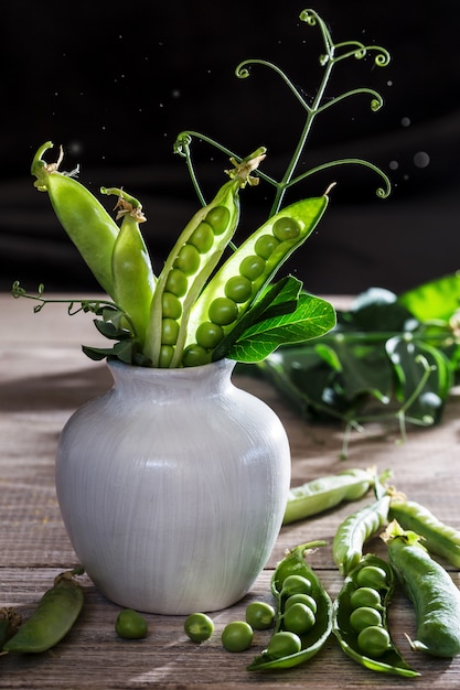 Peas in a vase.