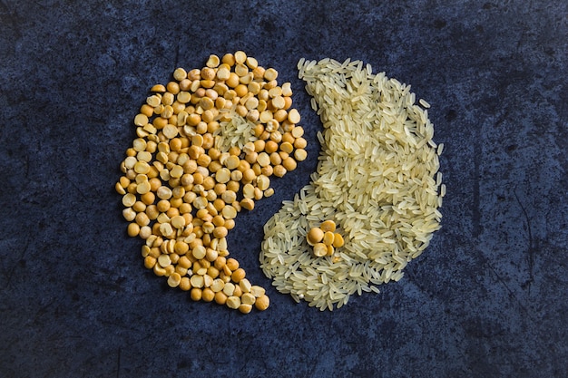 Photo peas with rice, in the form of yin and yang on blue