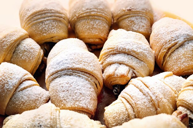 Peasant home baking Freshly baked hot sweet rolls with filling sprinkled with powdered sugar