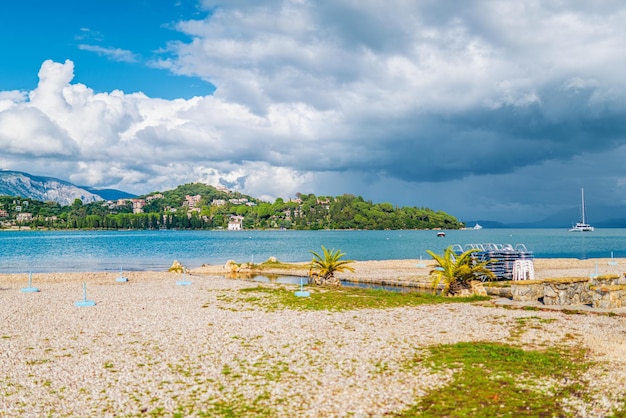 Pebble beach of Mediterranean sea bay against Corfu island